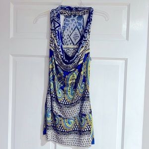 T-back top with band at bottom. Draped bodice super cute. Fitted.
